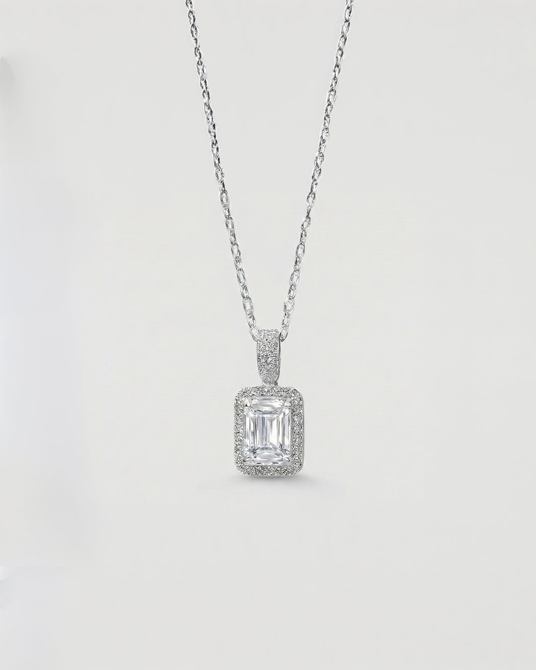 THE ELARA EMERALD HALO NECKLACE